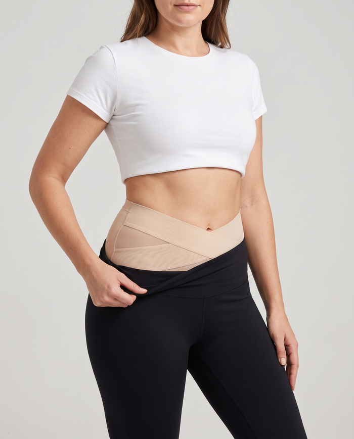 Tummy control panties worn under high-waisted leggings