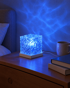 Soft Wave Lamp charging on a nightstand